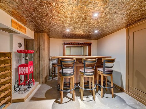 Belgo basement bar with gold tin roof