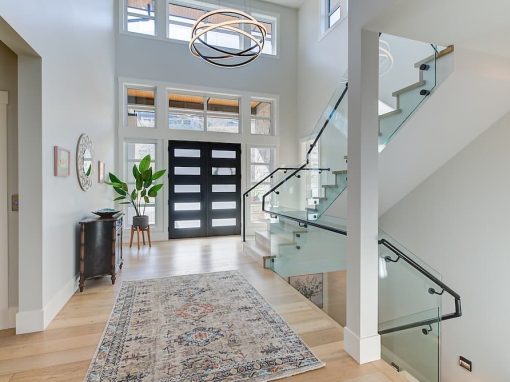 Lakecrest foyer with black front doors