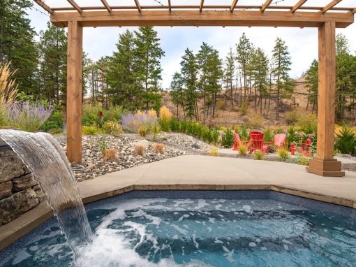 Long backyard jacuzzi with waterfall